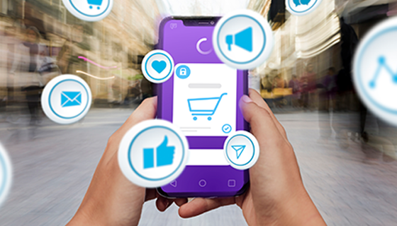 na imagem, vemos um celular e alguns símbolos referentes a carrinho de compras e redes sociais, fazendo alusão direta ao que seriam canais de venda.
